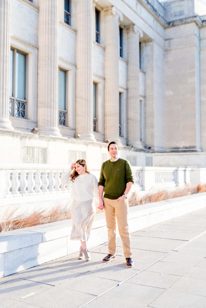 couple standing in front of Field Museum at sunrise 