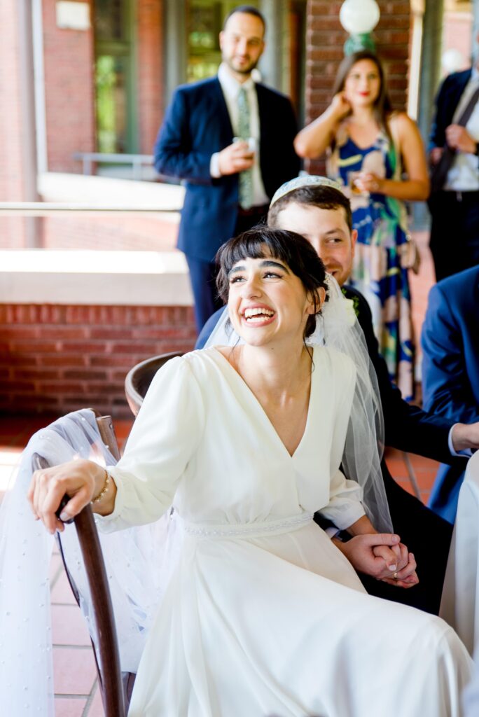 bride smiling at a moment off camera