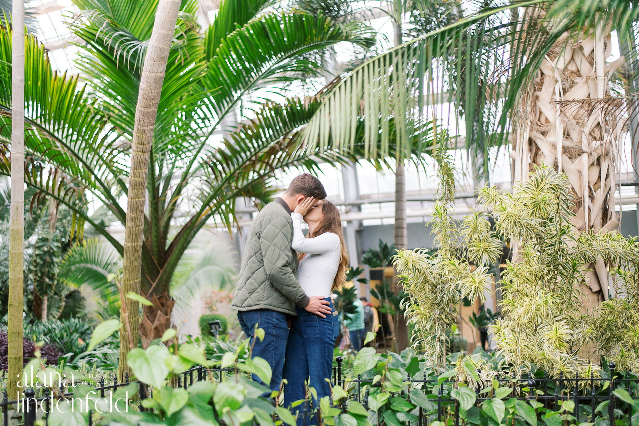 couple kissing at Garfield Park Conservatory palm room 