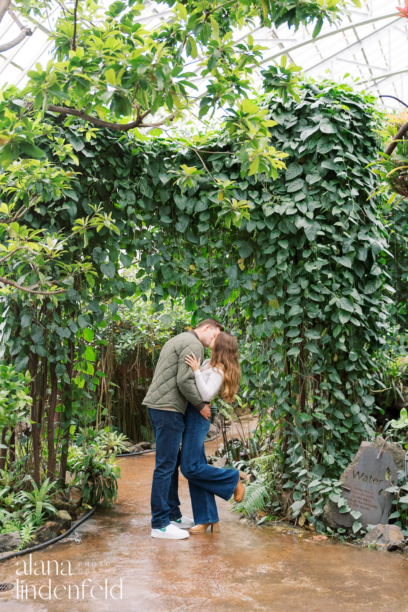 Garfield Park Conservatory engagement photo of couple in casual clothes