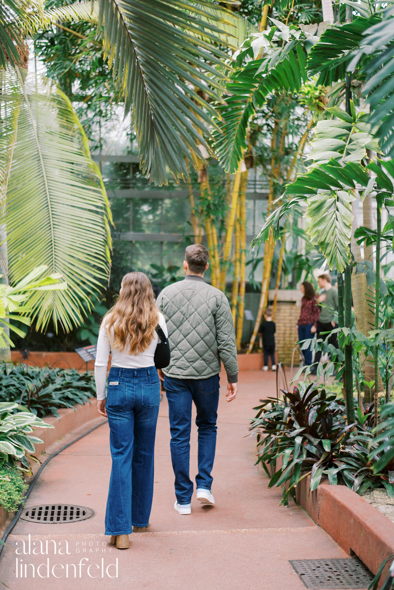 couple walking through palm room at Garfield Park Conservatory
