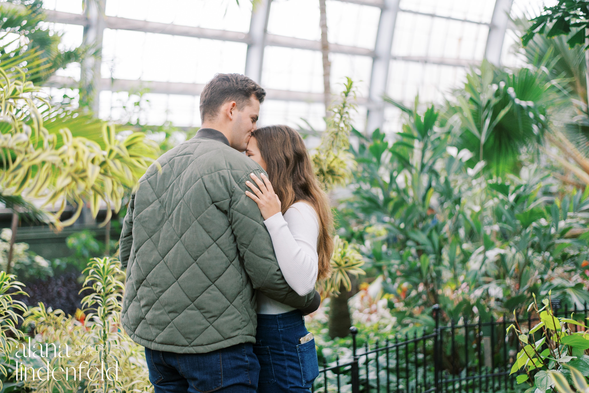 couple hugging after proposal at Garfield Park Conservatory