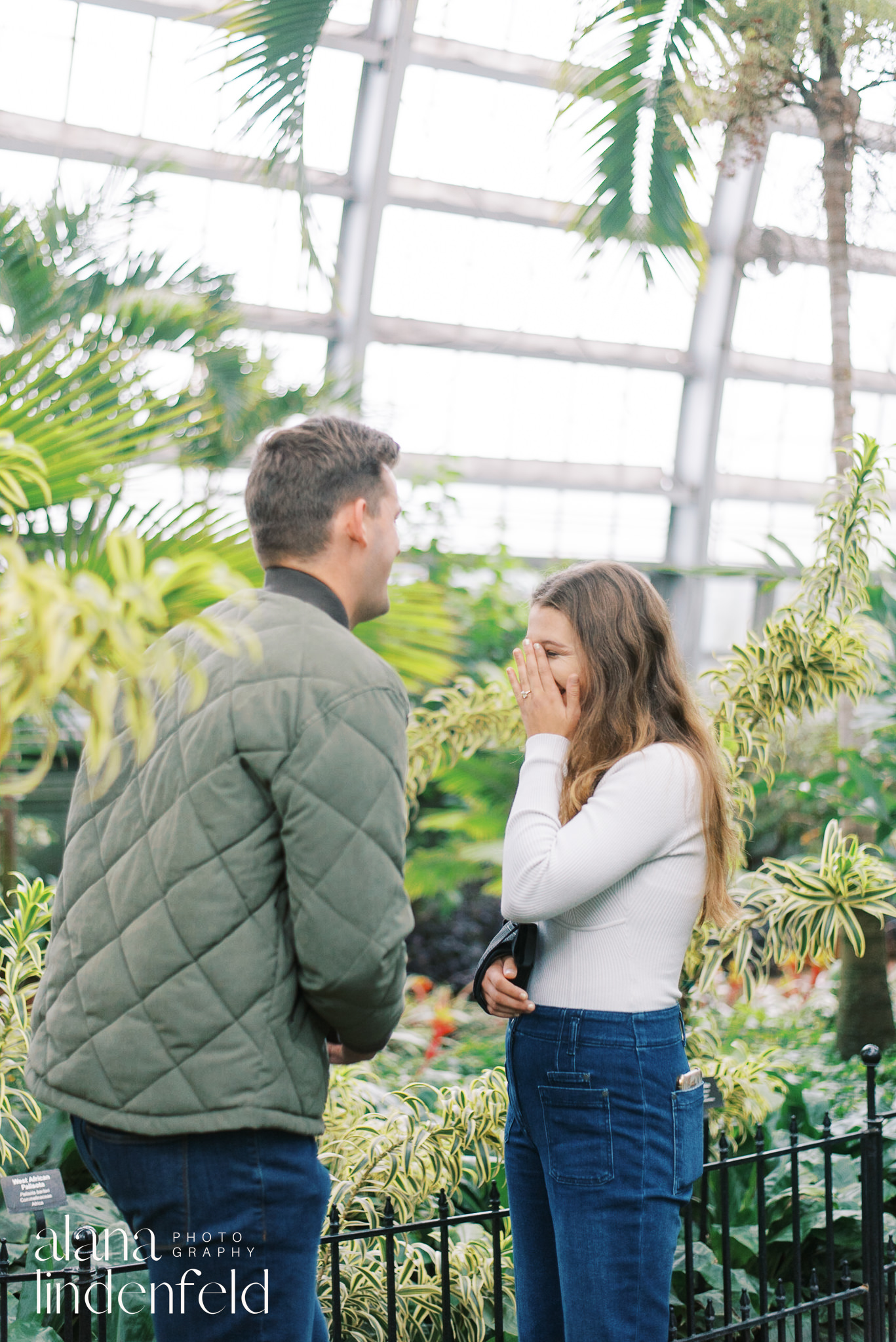 couple laughing after proposal at Garfield Park Conservatory