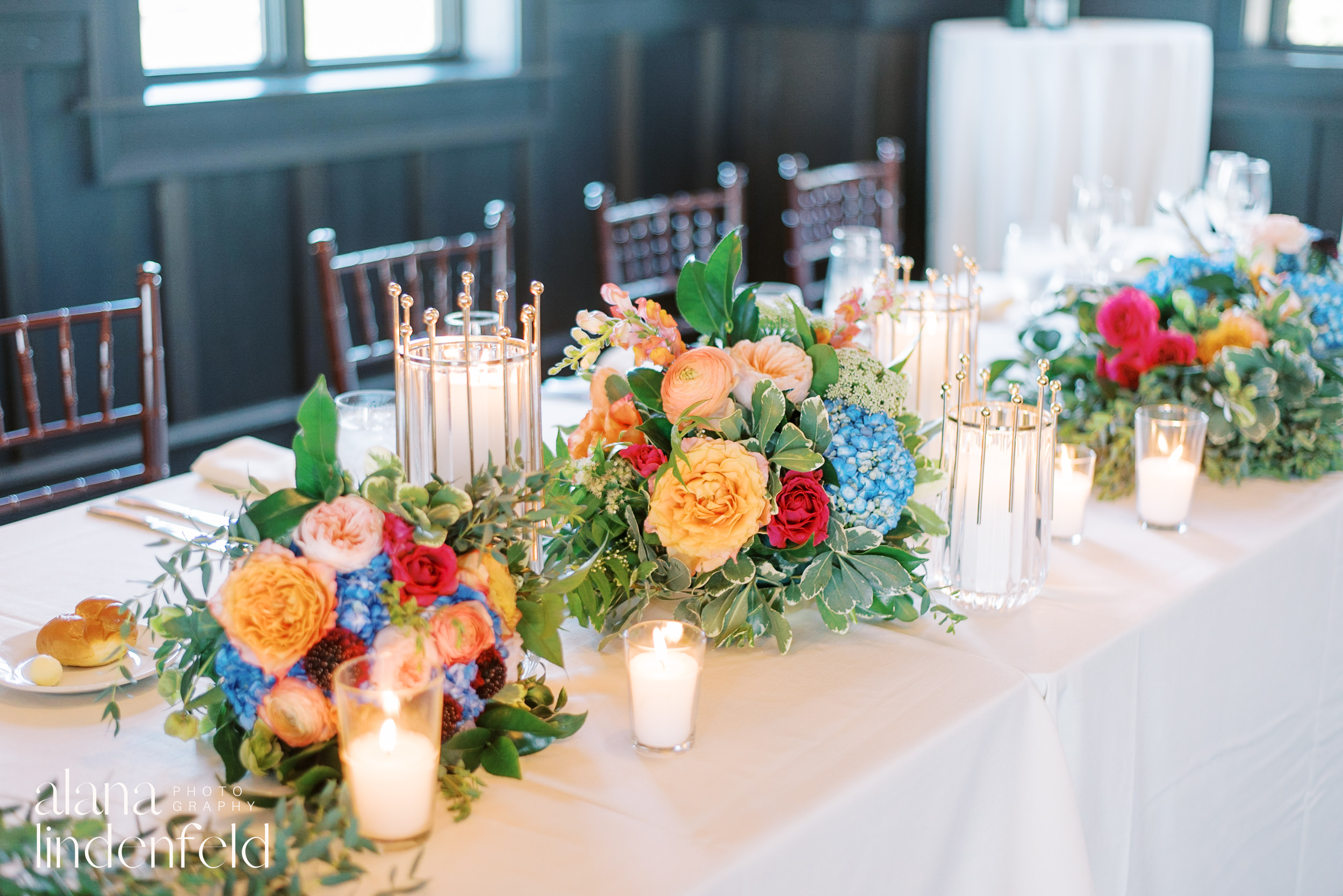 colorful wedding flowers table set up