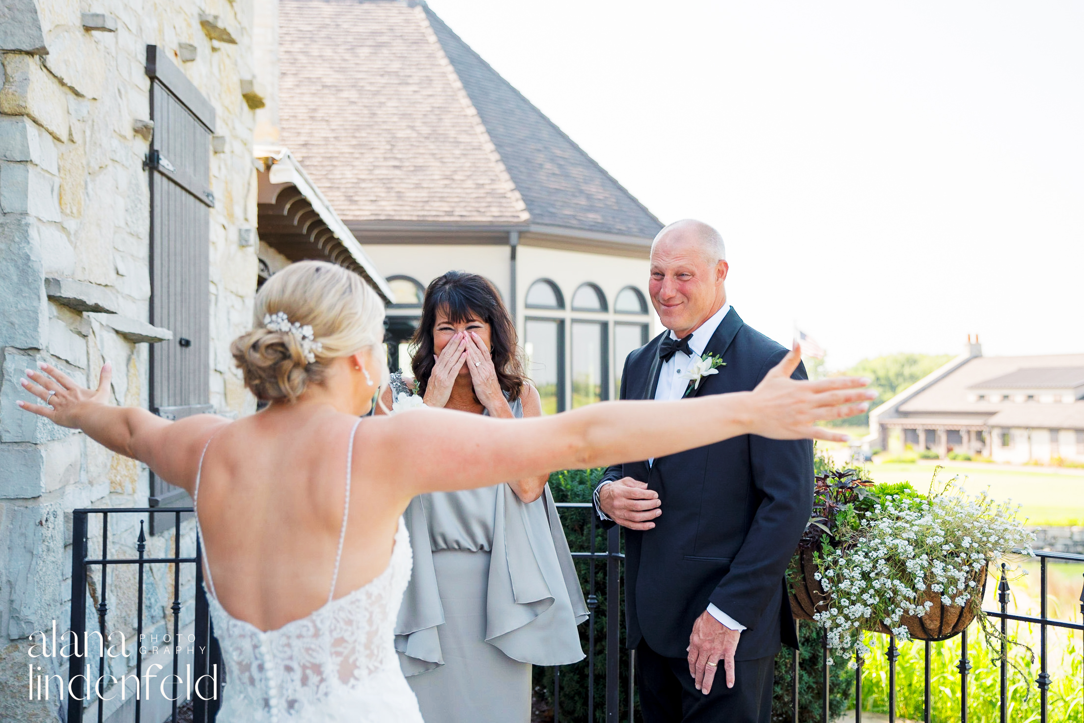 bride has first look with emotional parents at Mistwood Golf Club