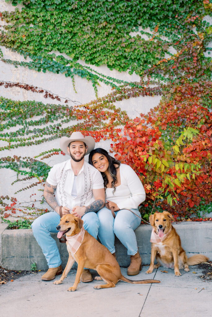 couple's fall engagement photos in Chicago South Pond with their dogs