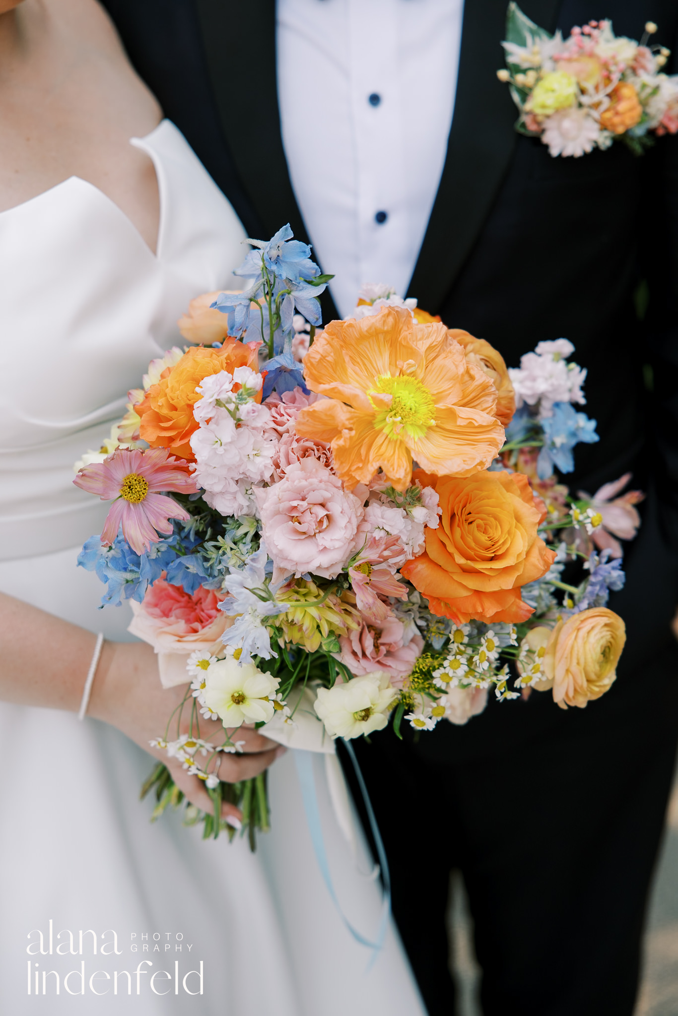 colorful summer wedding bouquet with orange poppies and delphinium 