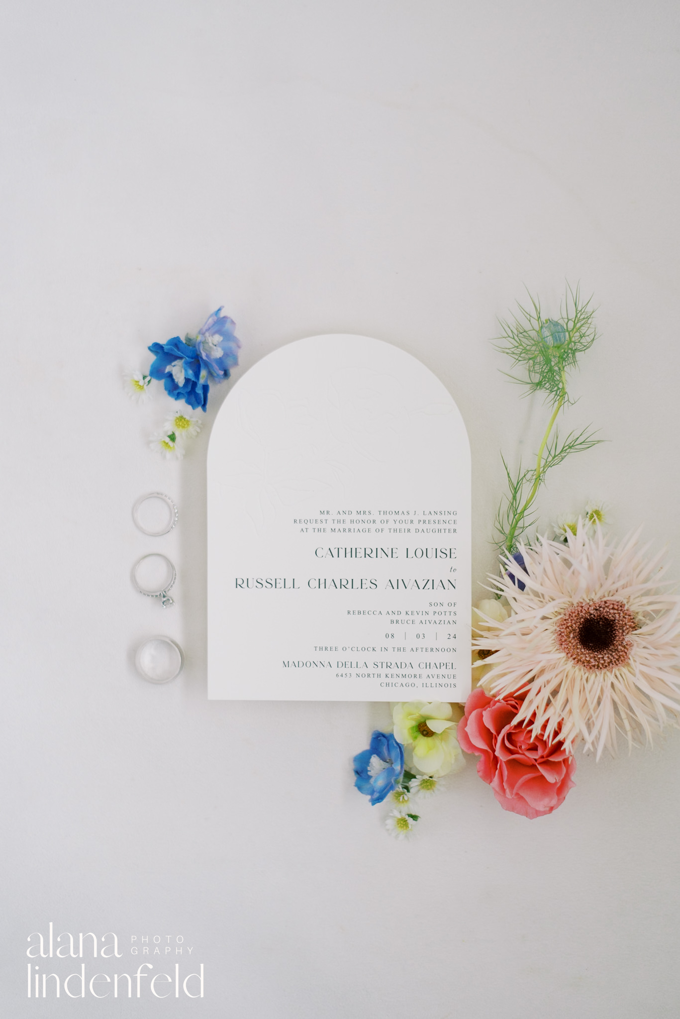 wedding ring flatlay with flowers