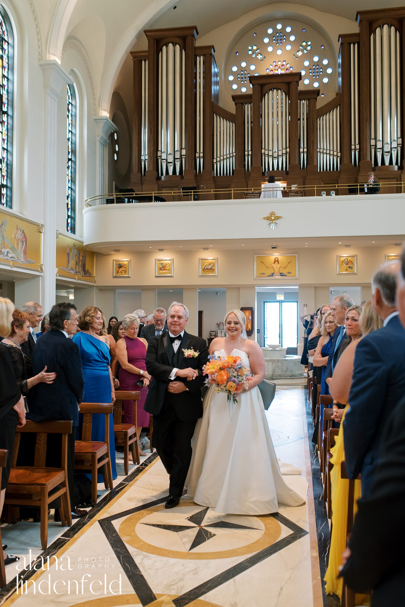 bride walking down church aisle at madonna della strada