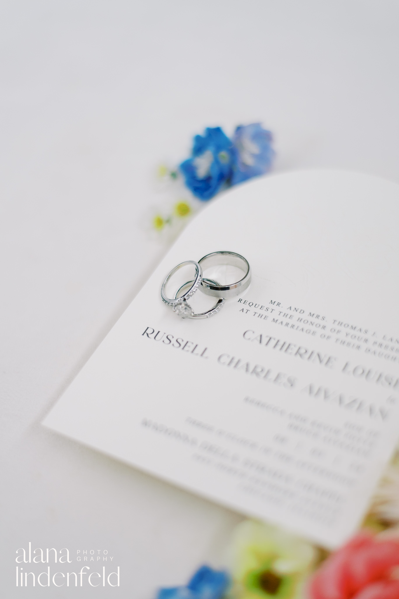 wedding flatlay with blue flowers