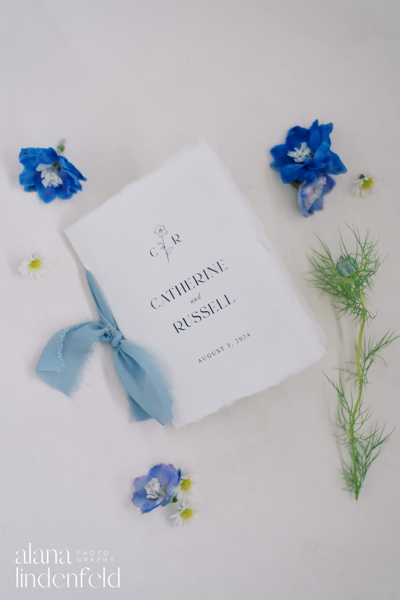 wedding vow book with blue ribbon
