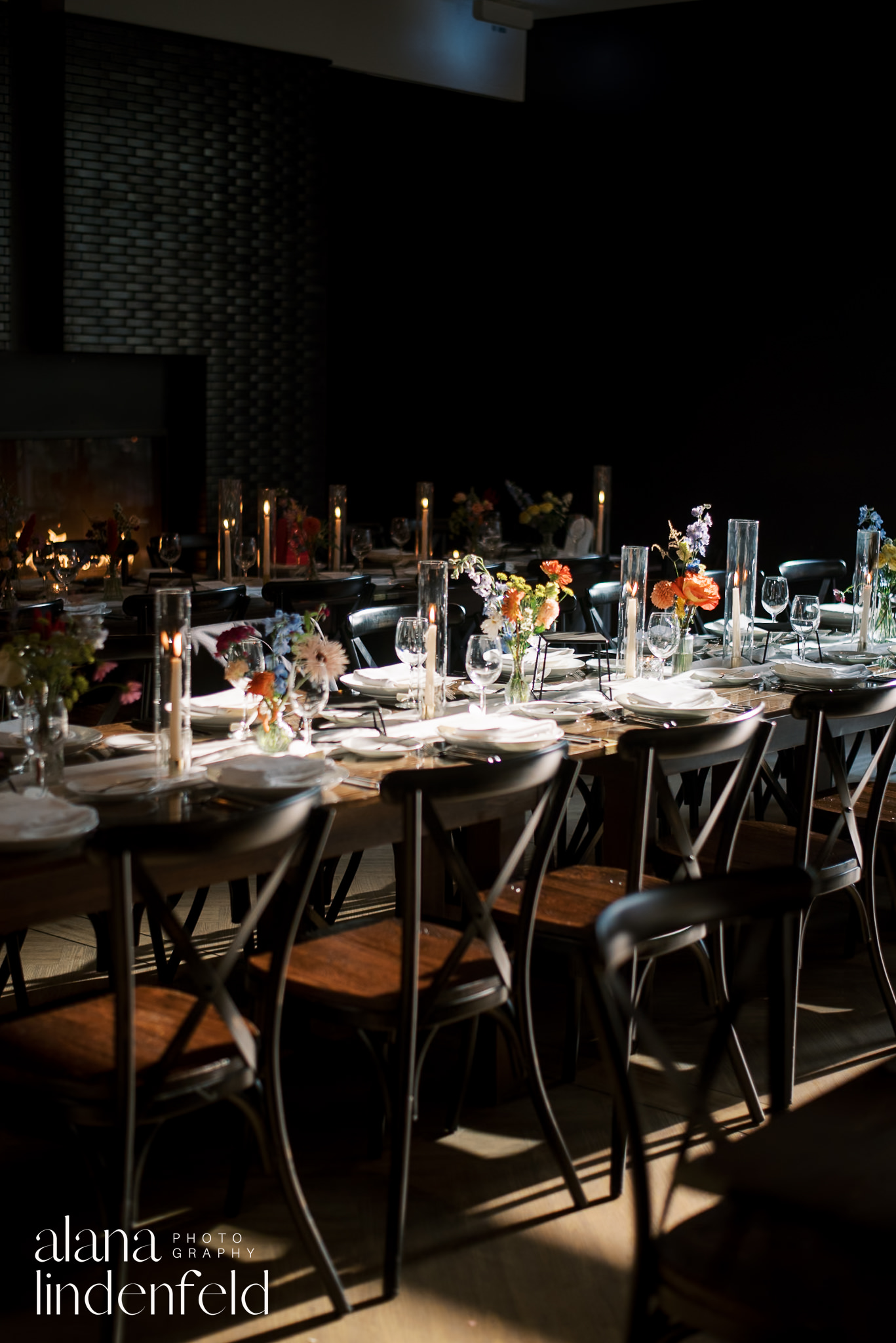 table settings at chicago winery wedding with colorful flowers