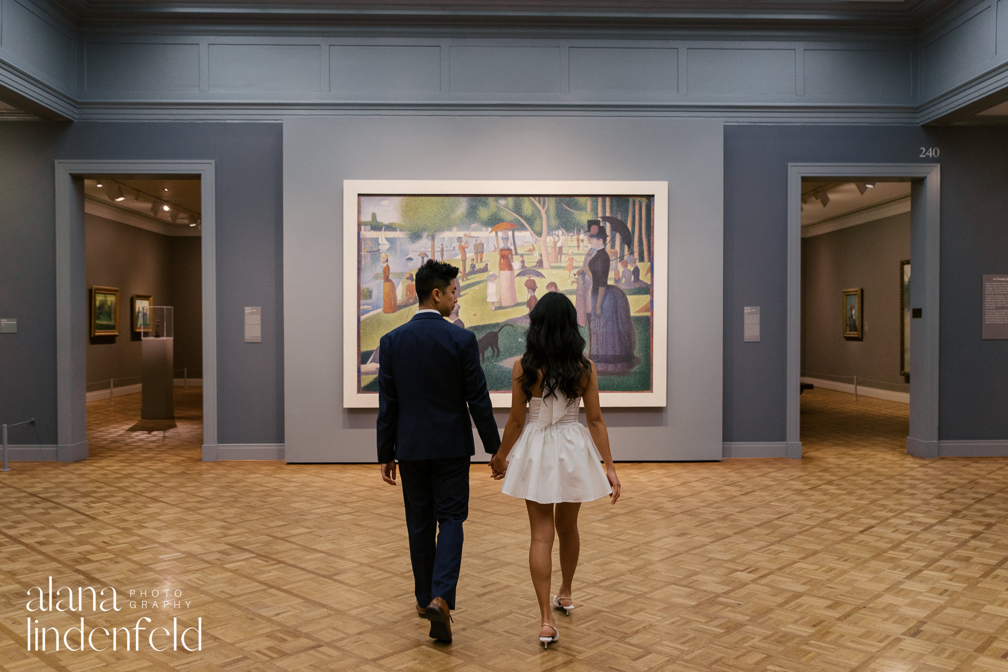 couple in front of Sunny Afternoon on the Island of La Grande Jatte at Art Institute of Chicago