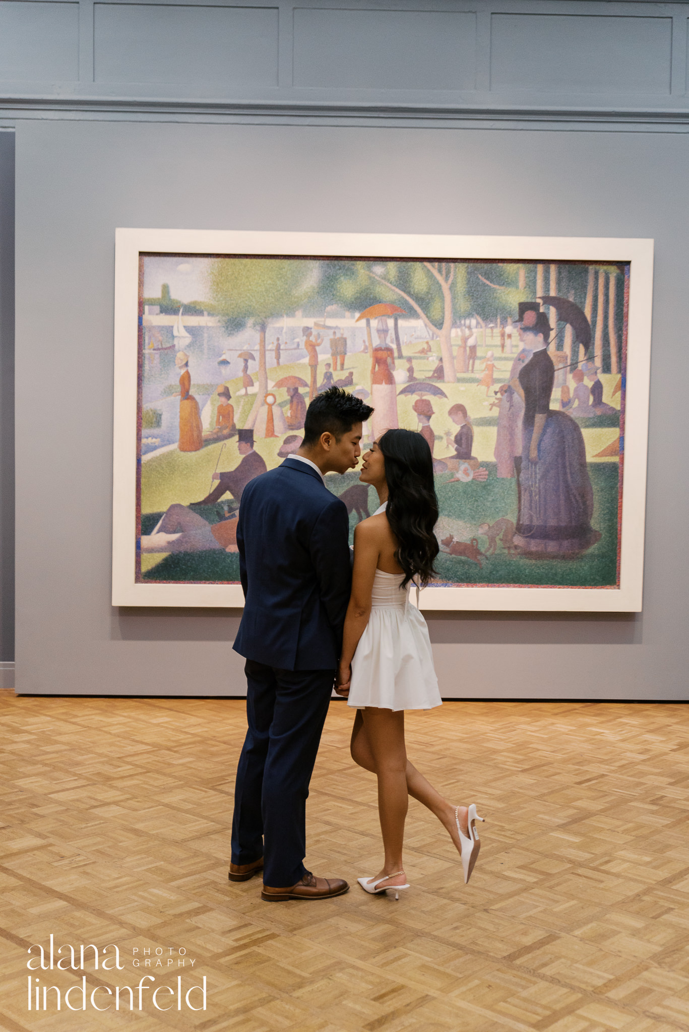 couple in front of Sunny Afternoon on the Island of La Grande Jatte at Art Institute of Chicago