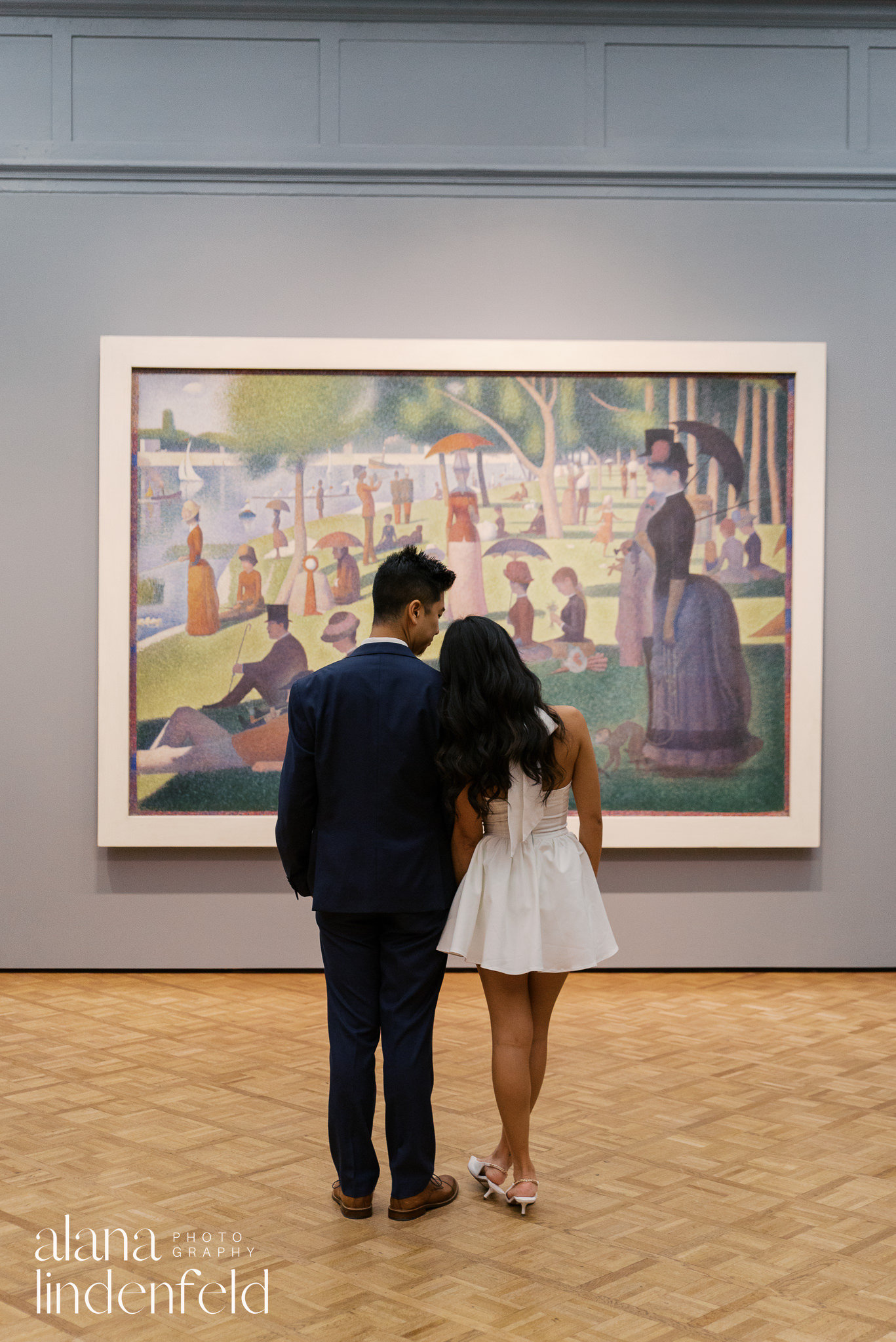 couple in front of Sunny Afternoon on the Island of La Grande Jatte at Art Institute of Chicago