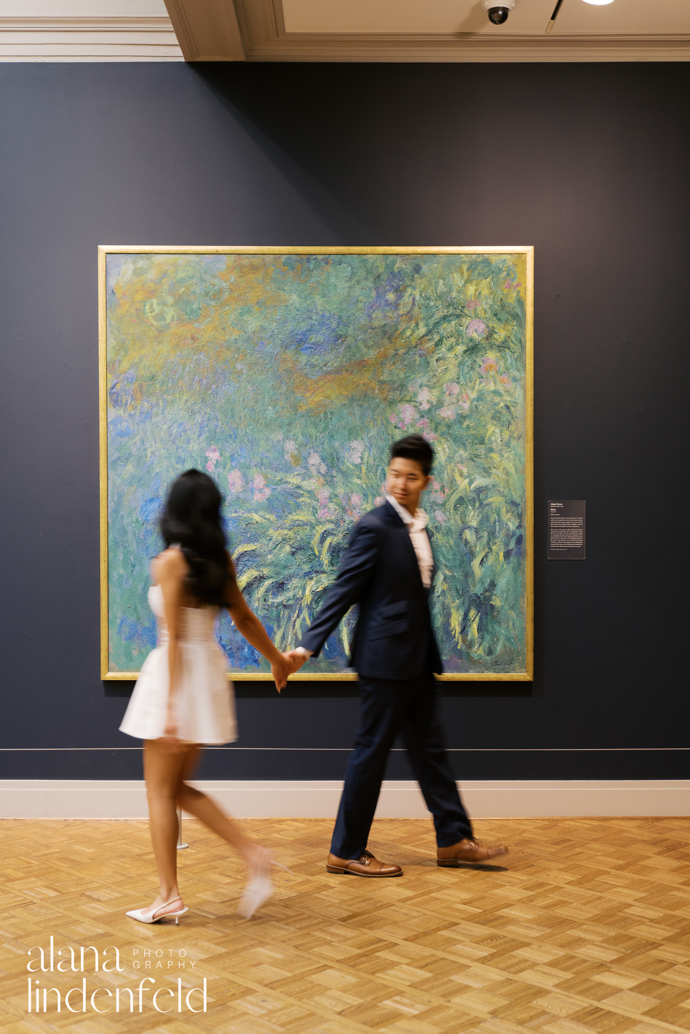 couple in front of Monet artworks at the Art Institute of Chicago engagement photos