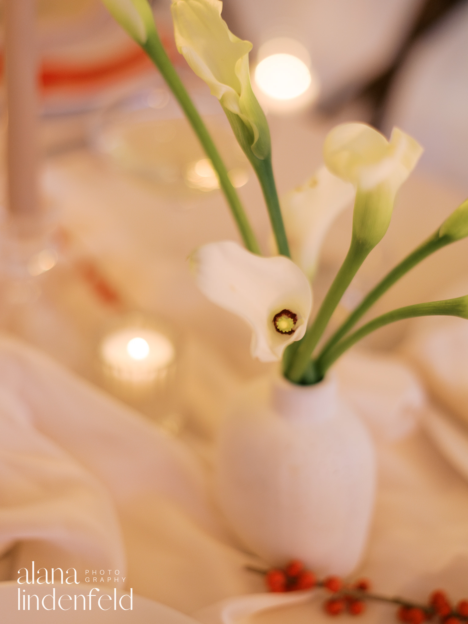 white calla lilies  at romantic candlelit tablescape