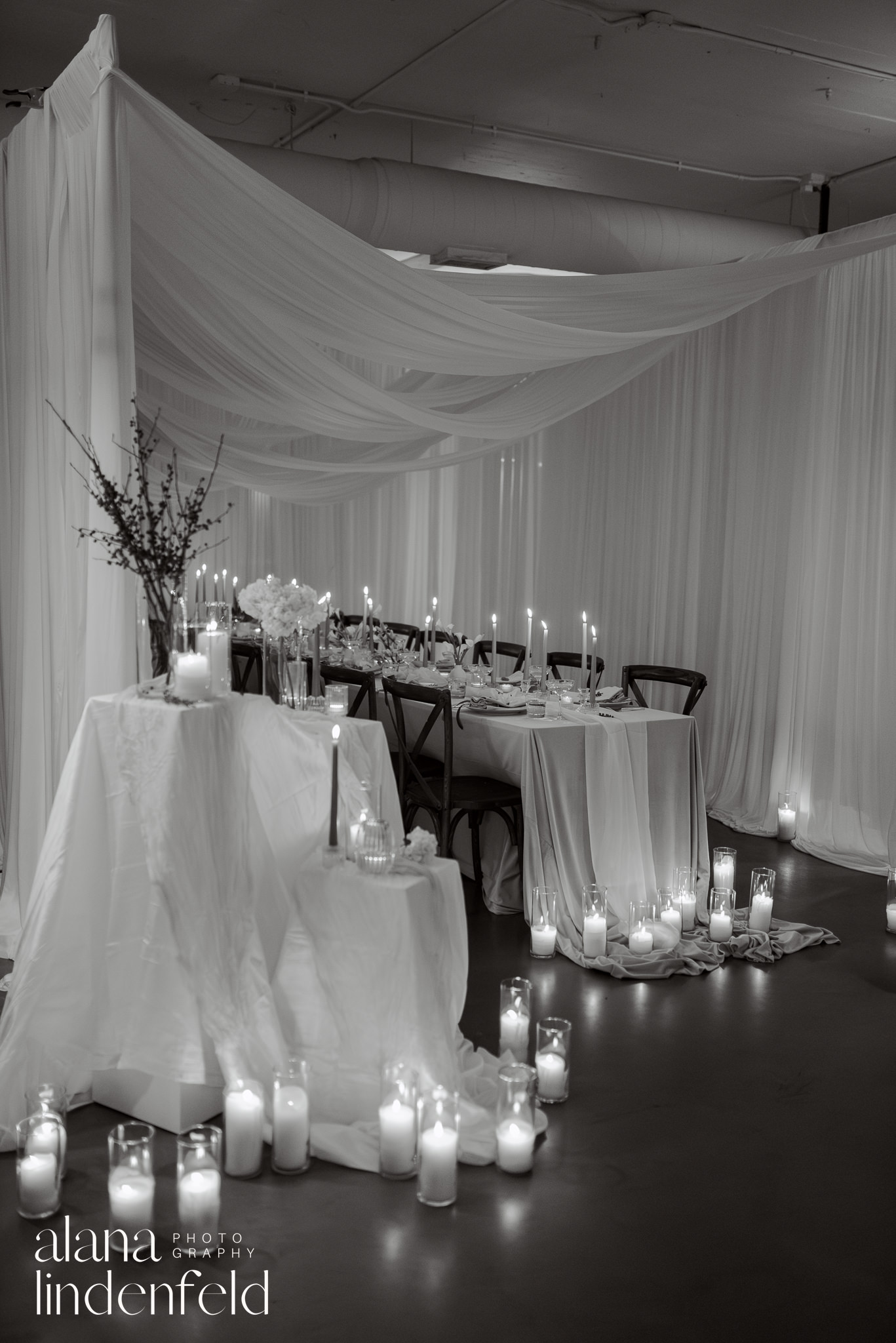 candlelit draped dinner reception at room 1520 in black and white 