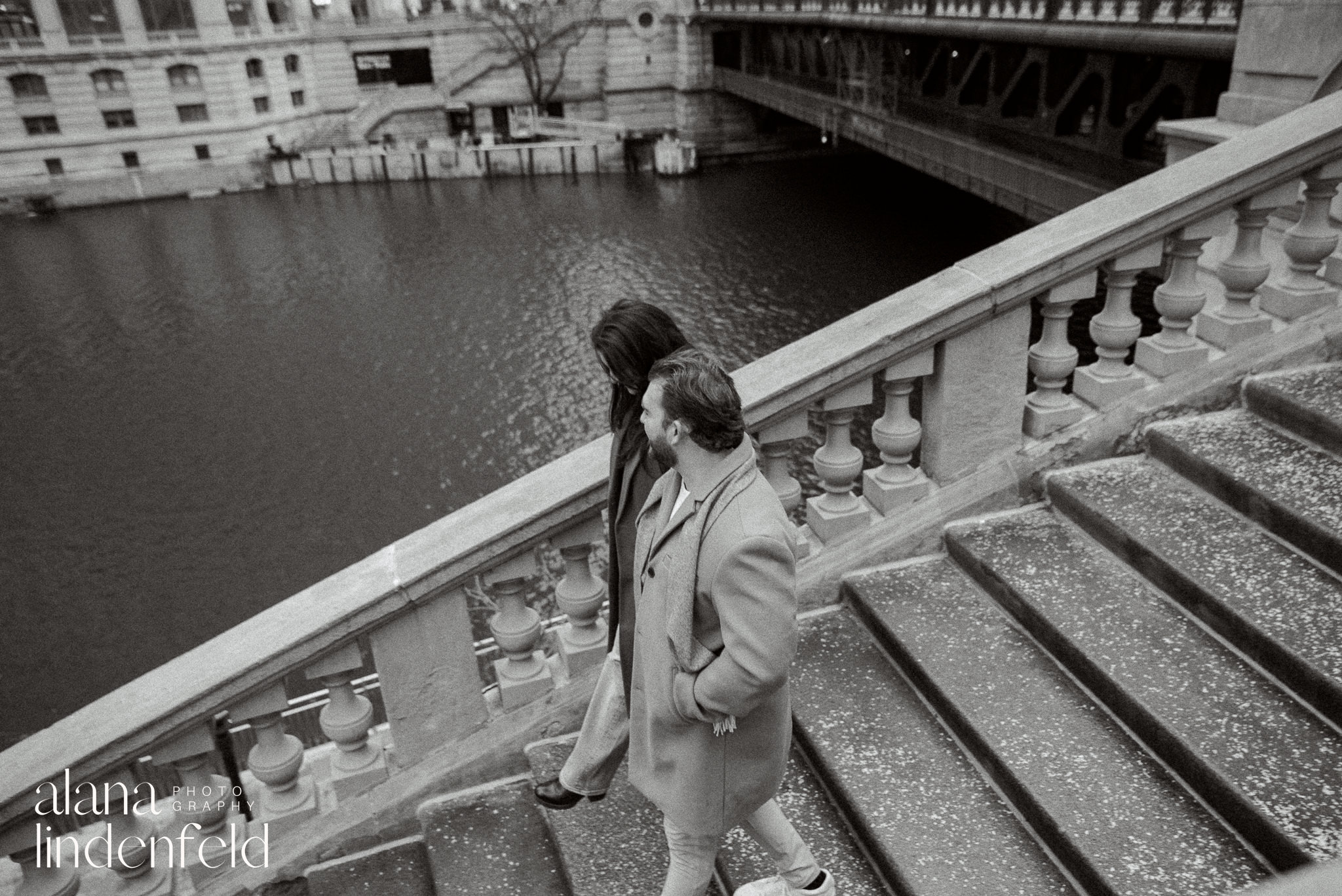 black and white engagement picture along the Chicago Riverwalk