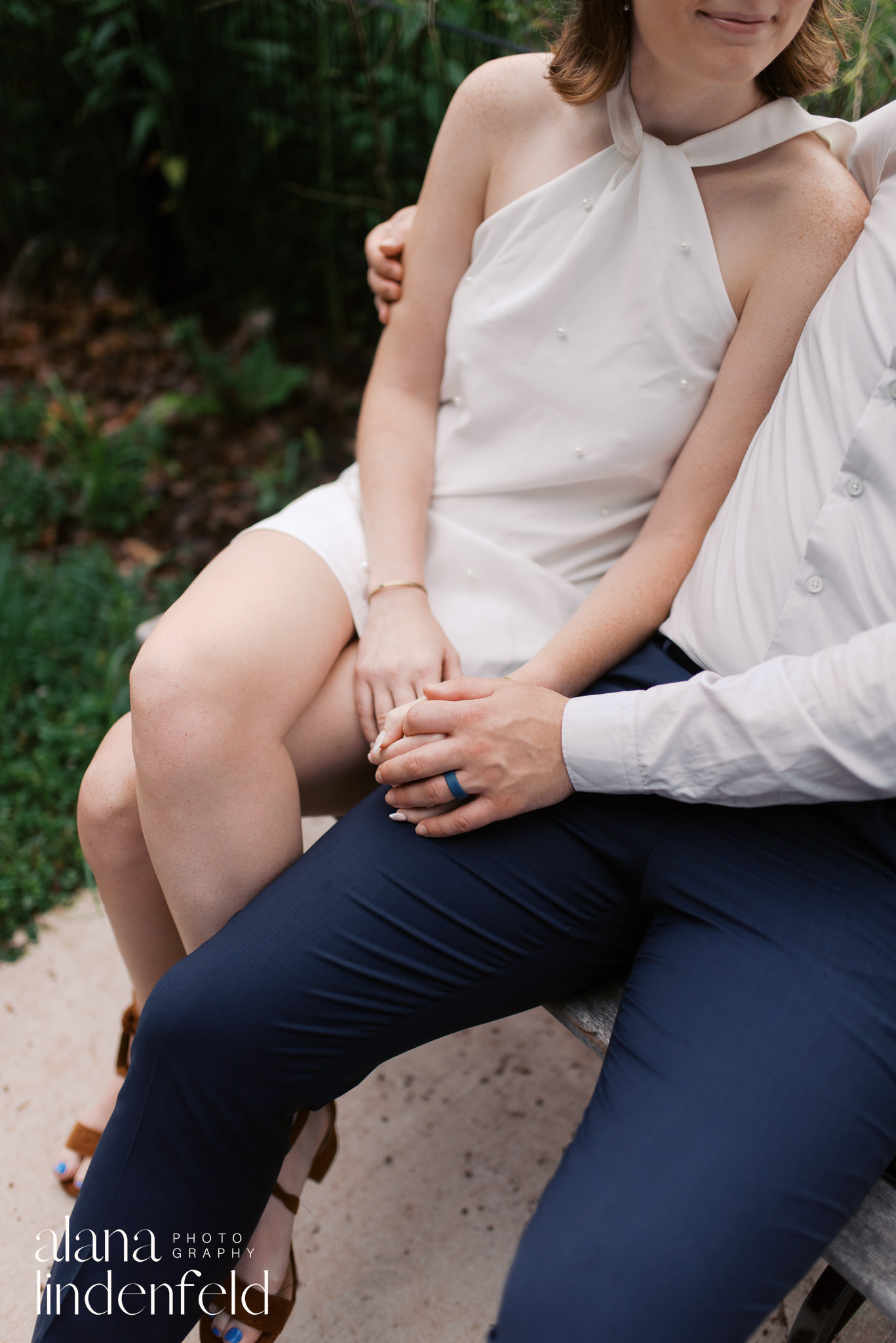 couple on a bench at North Pond in Lincoln Park for engagement pictures