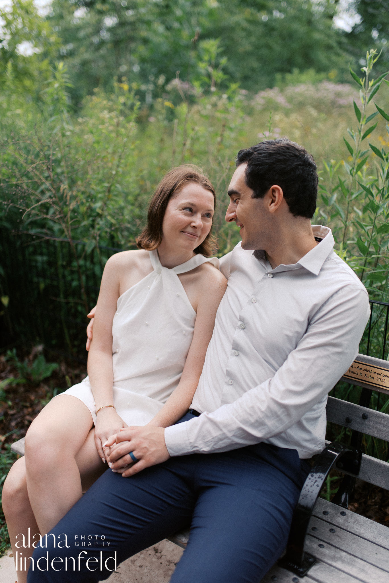 couple on a bench at North Pond in Lincoln Park for engagement pictures