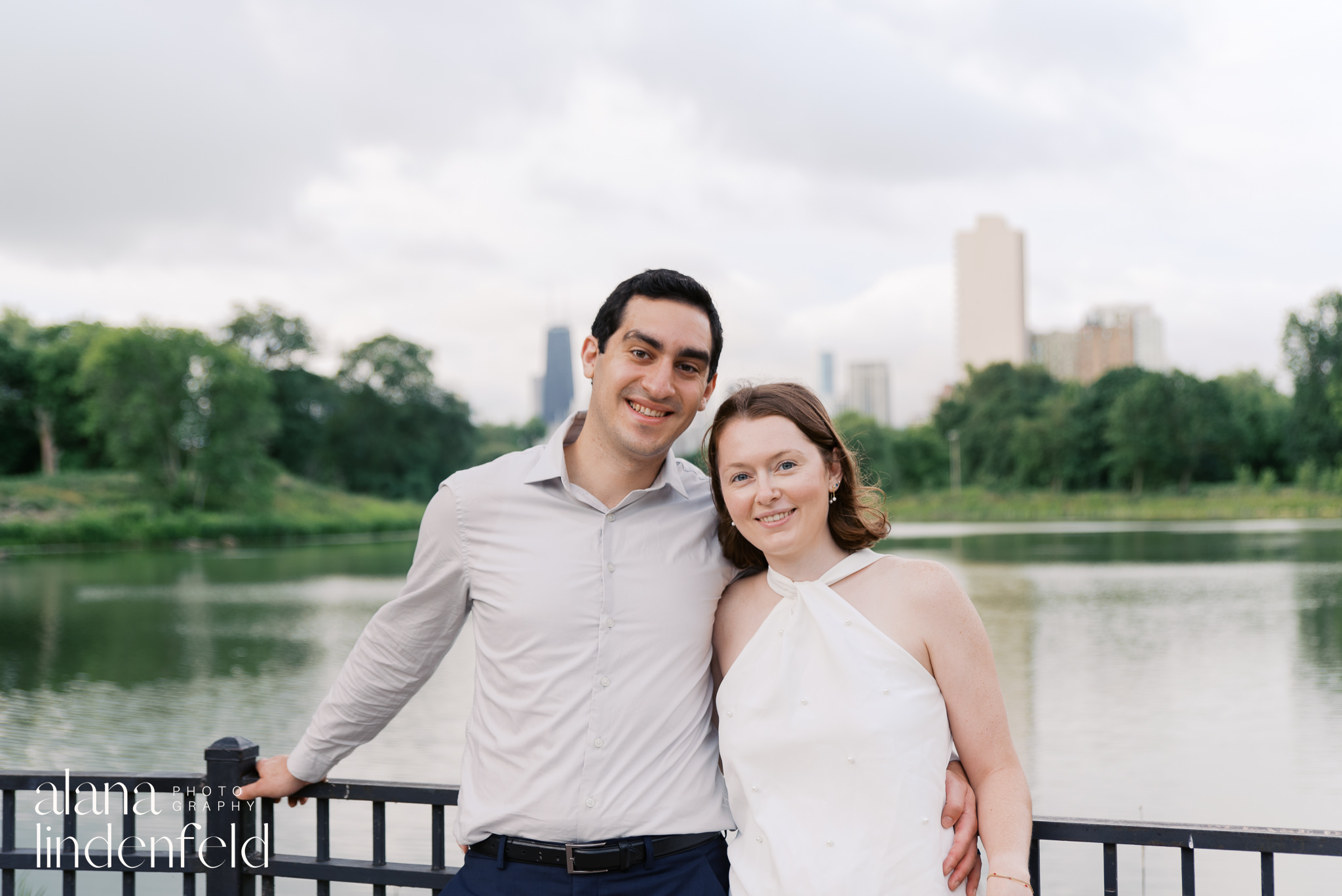 North Pond Lincoln park engagement photo of a couple smiling at the camera