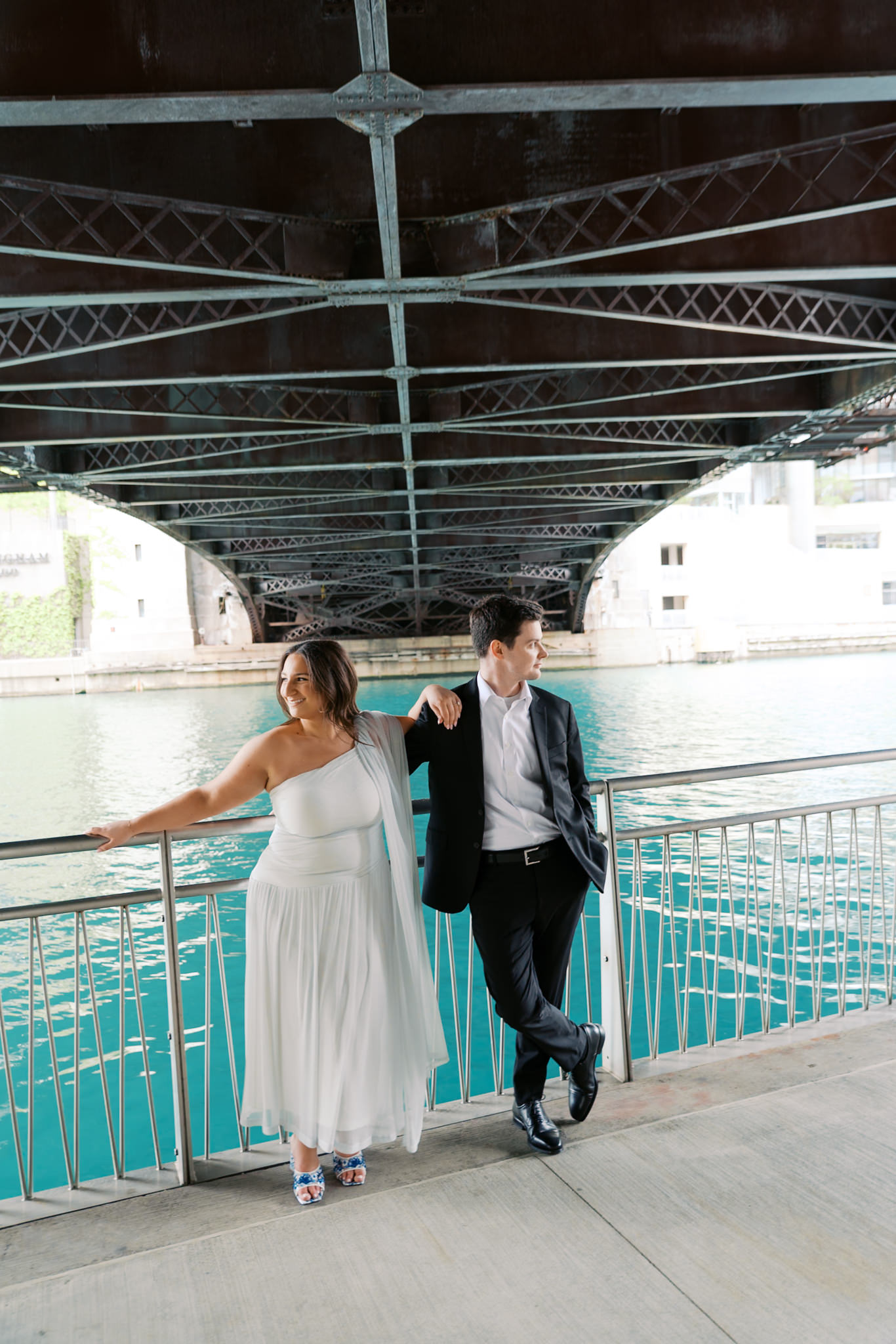 engagement picture under bridge along the Chicago riverwalk in summer
