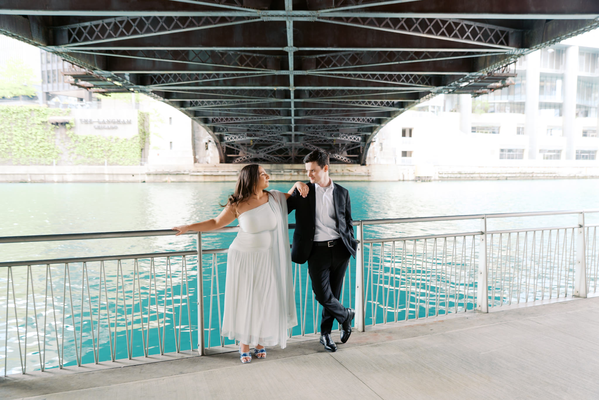 engagement picture under bridge along the Chicago riverwalk in summer