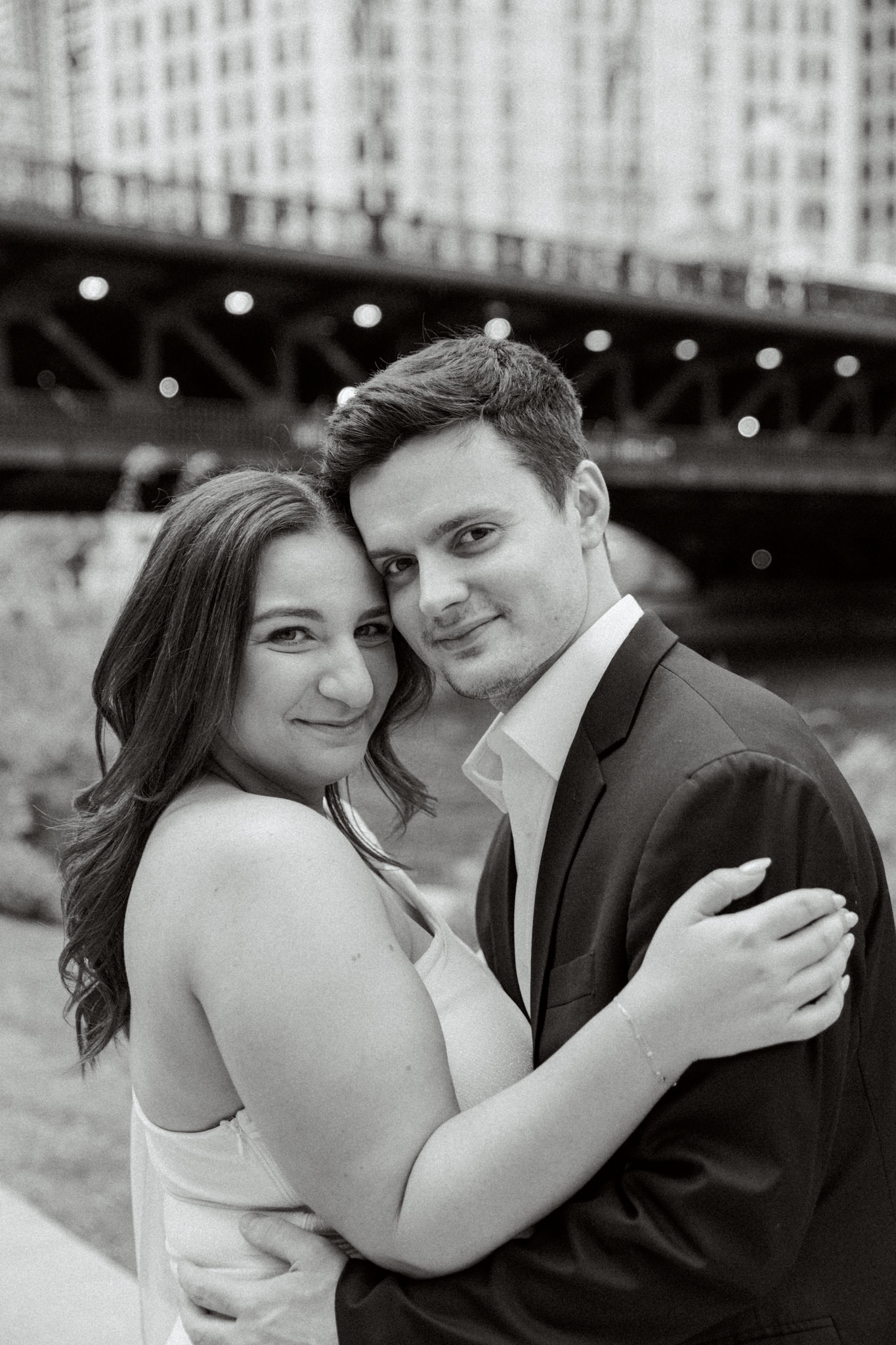 black and white photo of man and woman along Chicago Riverwalk
