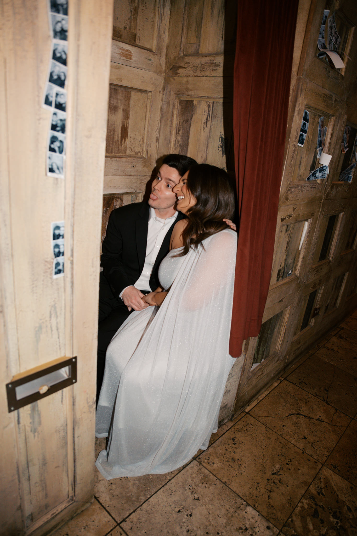 flash photos for engagement pictures at Gilt Bar in hallway with photobooth