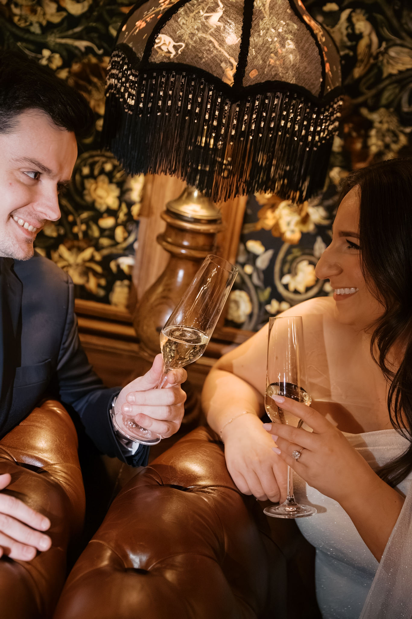 Couples cheersing champagne in the booths at Gilt Bar 